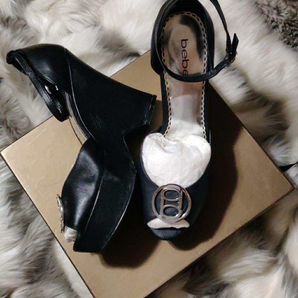 Bebe Black leather silver insignia platform heels